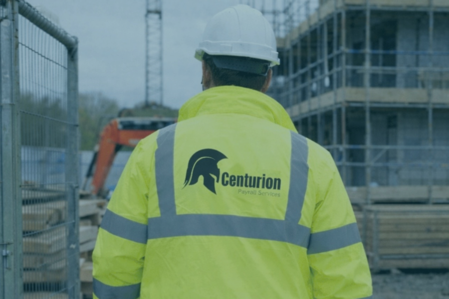 Man wearing Centurion Payroll PPE walking onto a building site